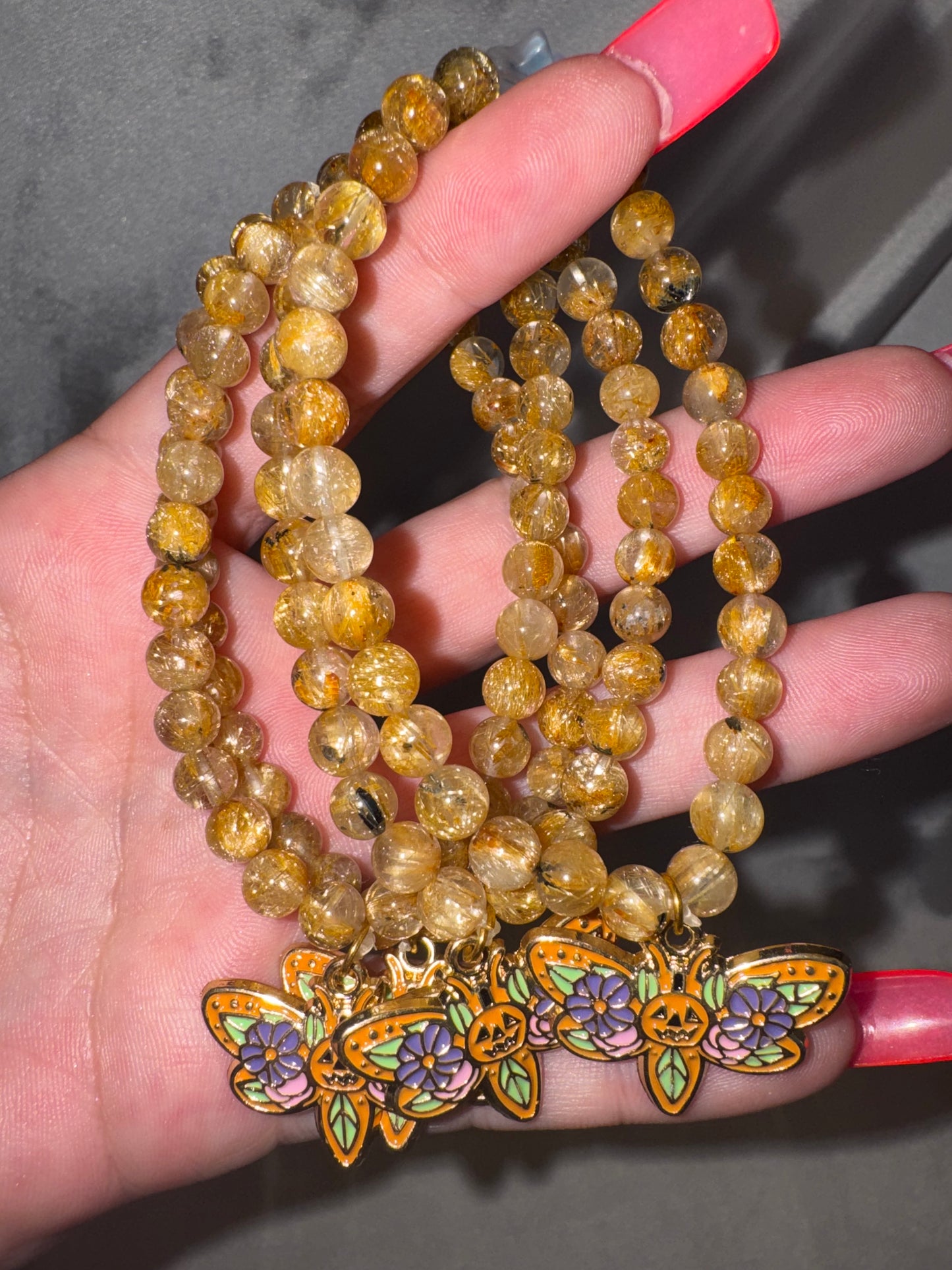 Gold Rutile Quartz AAA 6mm Bracelet with Pumpkin Moth